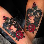 Matching tattoos of a heart, framing a woman and a skull. Clean and solid tattoo done by Moira Ramone. #MoiraRamone #25toLife #traditionaltattoo #matchingtattoos #skull #girl #roses