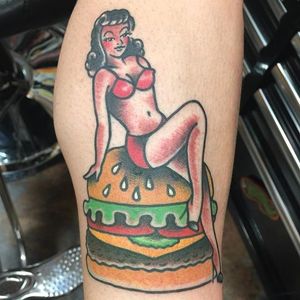 You don't have to choose between a sexy pin-up or a cheeseburger. Tattoo by Pon DeMan. #traditional #pinup #burger #cheeseburger #PonDeMan