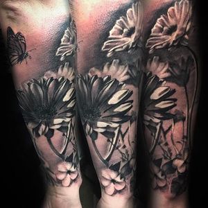Awesome floral inspired tattoo with a butterfly done by Shine. #ShinhyeKim #Shine #blackandgrey #fineline #flowers #butterfly