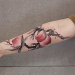 Peach tattoo by Chenjie.newtattoo #chenjienewtattoo #besttattoos #color #blackandgrey #Chinese #painting #illustrative #watercolor #peaches #peach #fruit #foodtattoo #fruittattoo #leaves #branch #nature