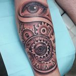 Black and grey eye and mechanical parts tattoo by dotyink. #blackandgrey #realism #dotyink #mechanical #cogs #eye #eyeball