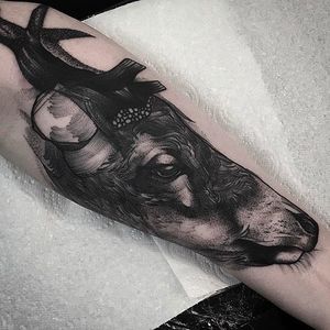 Deer head tattoo by Phil Wilkinson. Awesome detail and texture on this solid tattoo. #PhilWilkinson #deer #blackwork