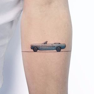 Tiny car tattoo by Ahmet Cambaz #AhmetCambaz #color #small #minimalism #realism #realistic #car #sportscar #linework #cuff #cartattoo #tattoooftheday