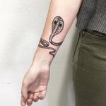 King Cobra-celet tattoo by Vlada Shevchenko. #VladaShevchenko #blackwork #feminine #women #cobra #bracelet #snake