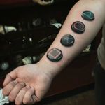 PlayStation-inspired tattoo by Ronny James. #realism #playstation #sony #nostalgia #videogames #retro #childhood #button