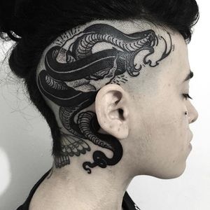 A dark, detailed snake winds around a client's scalp, by Erick Cuevas. (via IG—imtheraptor) #blackart #illustrative #blacktattoo #erickcuevas