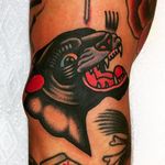 Bold and powerful panther head tattoo done by Jason Ochoa. #JasonOchoa #GreenPointTattooCo #traditionaltattoo #boldtattoos #panther #head