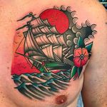 Clean and vibrant ship on chest tattoo by Filip Henningsson. #FilipHenningsson #RedDragonTattoo #traditionaltattoo #boldtattoos #ship