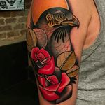 Beautiful falcon tattoo done by Kike Esteras. #KikeEsteras #neotraditional #falcon #rose #animaltattoo