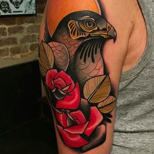 Beautiful falcon tattoo done by Kike Esteras. #KikeEsteras #neotraditional #falcon #rose  #animaltattoo