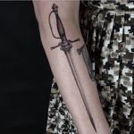Elegant dagger tattoo by Ed Taemets #EdTaemets #blackandgrey #blackwork #dagger #sword #weapon