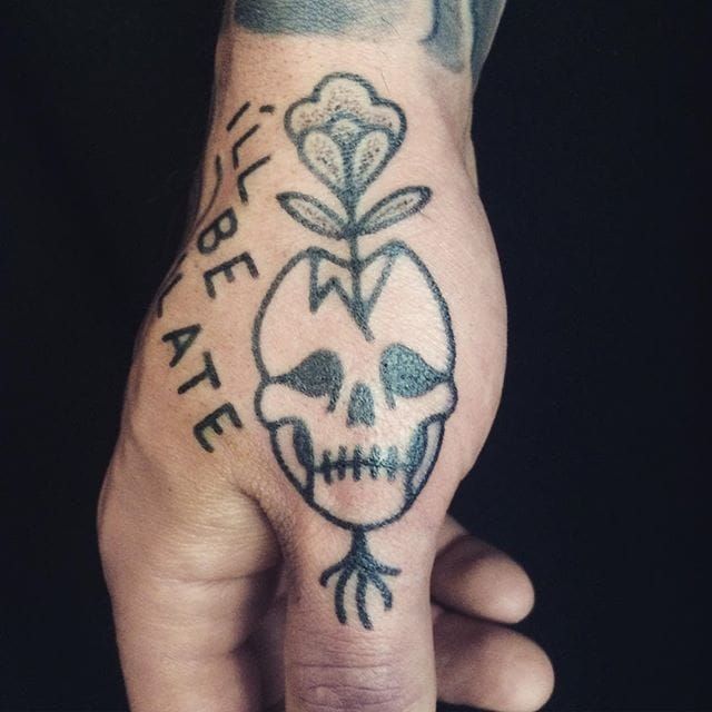Skull with flowers growing out of it tattoo | Orangetattooshop.com