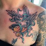 Clean and vibrant bird tattoo done by Alvaro Alonso. #AlvaroAlonso #NeoTraditional #animaltattoo #MalibuTattooSpain #bird #sparrow