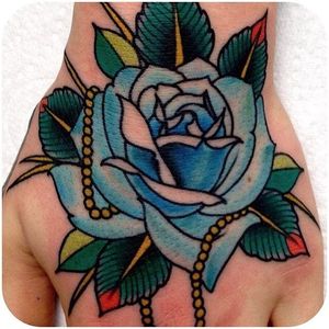 Hand job. @xamthespaniard #tattoodo #traditional #traditionalrose #rose #bluerose #color