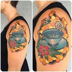 Teacup with a bee and blossom. Rad work by Katie McGowan. #katiemcgowan #blackcobratattoo #coloredtattoo #bee #blossom #teacup