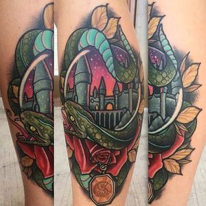 Slytherin's Hogwarts tattoo by Cody Dresser. #CodyDresser #neotraditional #slytherin #snake #pendant #HarryPotter #hogwarts #castle #popculture #film