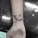Bow and arrow micro tattoo by Isaiah Negrete. #IsaiahNegrete #blackandgrey #fineline #microtattoo #bow #arrow