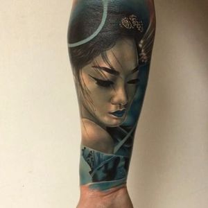 Stunning Geisha tattoo and I'm loving that blue! Photo from Vid Blanco on Instagram #VidBlanco #photorealism #realism #UKtattooer #minimalpalette #blackandgrey #geisha