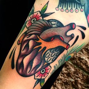 Beautifully done anatomical heart tattoo with some awesome blossoms in the background. #giacomofiammenghi #heart #neotraditional #blossoms #coloredtattoo #anatomicalheart