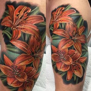High contrast realistic tiger lily tattoo by Paul Marino. #flower #tigerlily #realism #colorrealism #PaulMarino