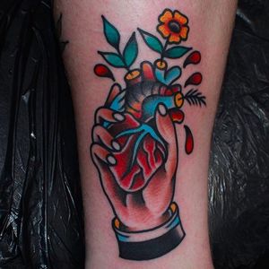 Hand holding an anatomical heart. Bold and clean work by CP Martin. #CPMartin #thedarlingparlour #sydney #traditionaltattoos #hand #heart