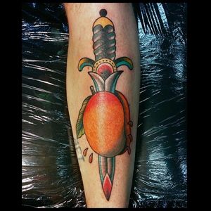 Traditional dagger and mango tattoo by Nate Vincent Szklarski. #traditional #dagger #mango #fruit #NateVincentSzklarski