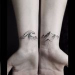 Matching tattoos by Stella Luo #StellaLuo #fineline #blackandgrey #linework #small #matching #wave #mountain