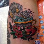Storm in a teacup tattoo by Suzi Q. #storminateacup #storm #teacup #tea #cup #wave #ship #traditional