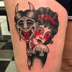 Creepy and cute looking girl tattoo holding up a demon mask. Clean and solid tattoo by Janitor Jake. #JanitorJake #HatCityTattoo #traditional #boldtattoos #girlhead #hannya #mask