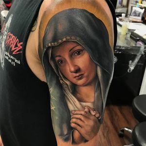 Mary tattoo by Kyle Cotterman #KyleCotterman #religioustattoo #color #realism #realistic #hyperrealism #portrait #VirginMary #prayer #Christian #Catholic #portrait #face #eyes #stars #angel #tattoooftheday