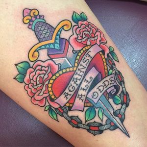 Girly traditional dagger tattoo by Sarah K. #SarahK #girly #traditional #dagger #flower #heart #heartdagger