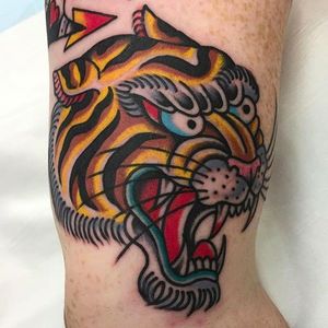 Fierce looking tiger head tattoo done by Fergus Simms. #FergusSimms #MelbourneTattooCompany #traditionaltattoo #boldtattoos #tiger
