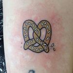 Tiny traditional pretzel tattoo by James Monterio. #traditional #tiny #pretzel #food #JamesMonterio