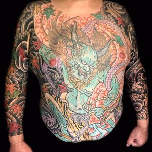 Incredible bodysuit by Henning Jorgensen #HenningJorgensen #Japanese #color #bodysuit #oni #yokai #demon #clouds #leaves #tigerprint #rope #monster #folklore #nature #deity #tattoooftheday
