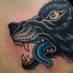 Awesome detail shot of a clean and solid wolf tattoo done by Graham Beech. #GrahamBeech #NeoTraditional #AnimalTattoos #wolf #wolfhead