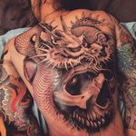 Whoa. This person better be badass to warrant a badass tattoo like this. #JoaoBosco #Fantasy #FantasyTattoos #skull #dragon #Japanese #blackandgrey
