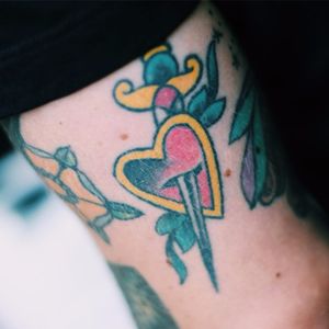 Traditional daggered heart tattoo #traditonal #daggerheart #heart #dagger #traditionalheart #color #streetstyle #TattooStreetStyle