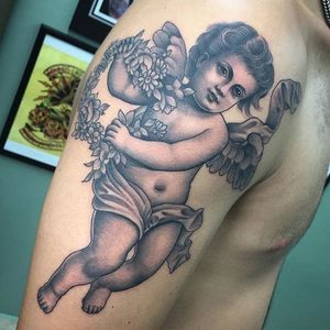 An exquisite black and grey cherub by Gian Karle Cruz (IG—giankarle). #blackandgrey #cherub #GianKarleCruz #InkMaster #neotraditional