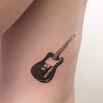 Stringless electric guitar tattoo by René O'Donnell-Gibson. #ReneODonnelGibson #rene #linework #folktraditional #guitar
