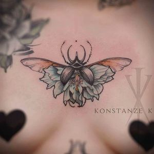 Clean beetle sternum tattoo done by Konstanze K. #KonstanzeK #illustrativetattoos #beetle #floral