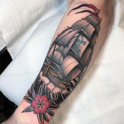 Pirate ship at sea. Tattoo by Jean Le Roux #JeanLeRoux #sailortattoos #color #blackandgrey #traditional #realism #neotraditional #mashup #ship #pirateship #skullandcrossbones #flower #waves #ocean #pirate