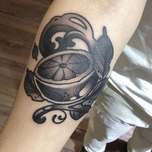 Black and grey orange tattoo with an art nouveau filigree spin. Tattoo by Omar Marrero. #orange #citrus #fruit #blackandgrey #artnouveau #filigree #OmarMarrero