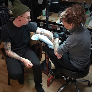 Tattoo artist and organizer of Still Not Asking For It, Ashley Love, tattoos an eager customer. (Photo by Katie Vidan) #StillNotAskingForIt #AlliedTattoo #AshleyLove #JoyfulHeartFoundation #rapeculture #endrapeculture