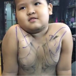 Photo from Phan Văn Tài's live video on Facebook. #viral #child #tattooedchildren #tattooedkids #parent #shocking