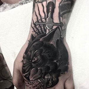 Daggered panther head tattoo on the hand by Neil Dransfield @Neil_Dransfield_Tattoo #NeilDransfieldTattoo #Black #Blackwork #Blackworkers #DarkTattoos #DarkArtists #Dagger #Panther #NeilDransfield