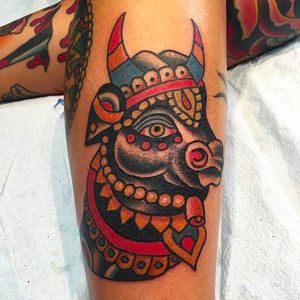 Bejewelled bull tattoo. Clean and colorful tattoo by Robert Ryan. #RobertRyan #esoteric #boldtattoos #traditionaltattoos #bull #horned