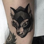 Awesome traditional wolf head tattoo done by Macarena Sepulveda. #MacarenaSepulveda #Wolf #wolfhead #blackwork