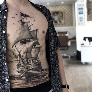 Like ships passing in the night...Tattoo by Daniel Paarup #DanielPaarup #sailortattoos #realism #illustrative #mashup #birds #ship #boat #sails #sailing #ocean #sea #chestpiece #stomachtattoo #detailed #seascape