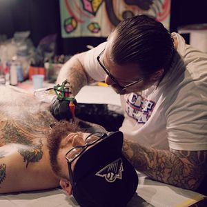 Greg Christian tattooing at this years Elm Street Tattoo Fest in Texas. (Photo by Jessica Paige) (IG - gregchristian4130)