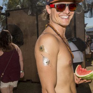 Even the guys were rocking the temporary tatts, photo by Shane Lopes for LA Weekly #coachella #festival #tattoostyle #fashion #flashtattoo #temporarytattoo